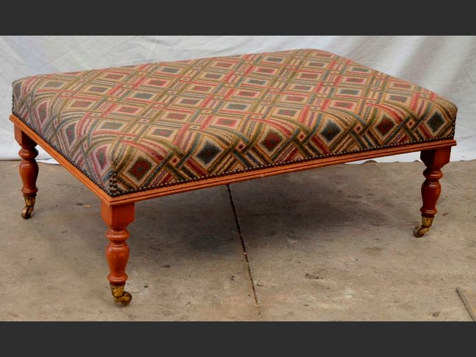 UPHOLSTERED OTTOMAN ON BRASS CASTORS, 102 x 65 x 40cm