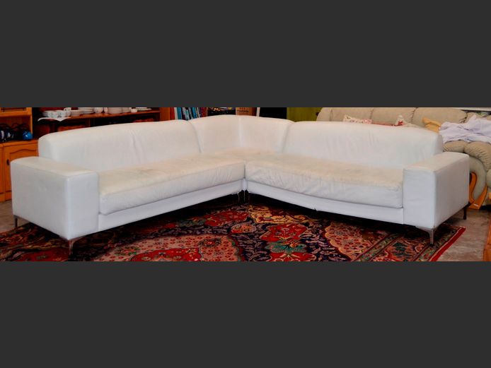WHITE LEATHER L-SHAPED LOUNGE SUITE, 285 x 285cm [Leather cracking in places, frame damaged]