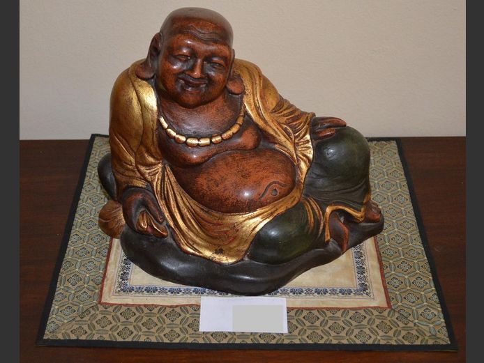 CARVED, GILDED & HAND PAINTED LAUGHING BUDDHA FIGURINE, 26 x 15.5 x 20cm, on PERSIAN MAT, 32 x 28cm