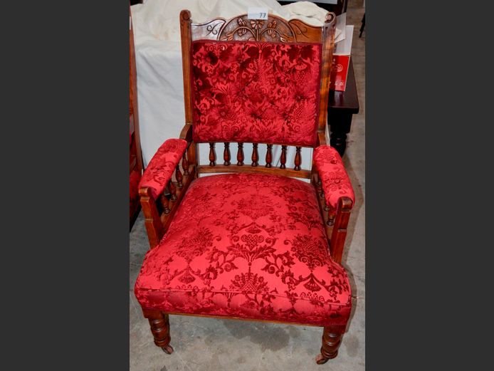 STAINED OAK & DEEP RED UPHOLSTERED GRANDMOTHER'S ARMCHAIR ON CASTORS