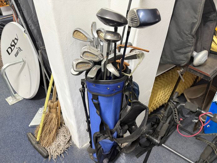 Variety of branded golf clubs with carry bag