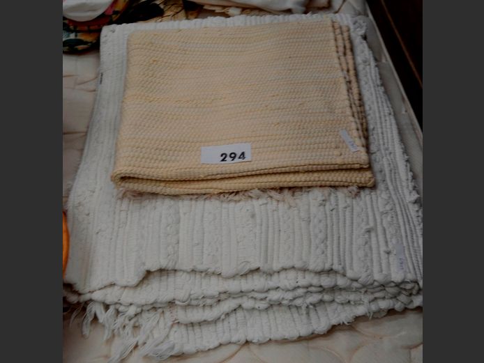 WHITE WOVEN CARPET & A BEIGE RUG