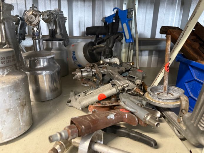 Large lot of spray gun nozzles and 2 spray guns