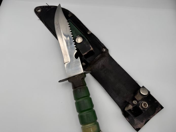 Hunting knife with green handle with leather holster