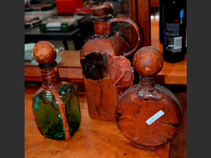 COLLECTION OF 3 LEATHER CLAD DECANTERS [Leather damaged]