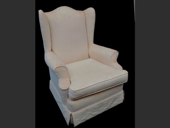 CREAM UPHOLSTERED WINGBACK ARMCHAIR