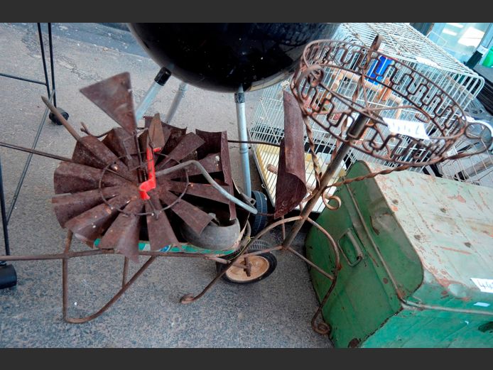 METAL PLANT STAND & AN ORNAMENTAL WHEELBARROW [Rusty]