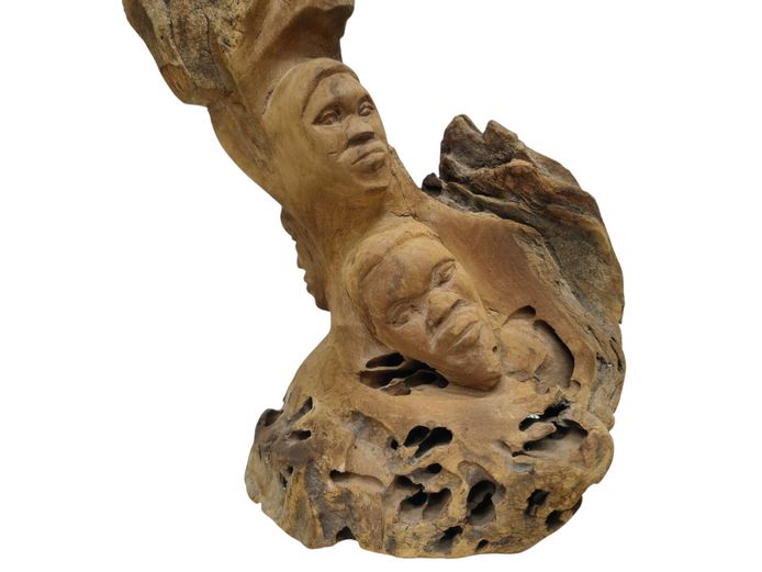 Hand-Carved African Driftwood Sculpture Featuring Carved Faces & Squirrel