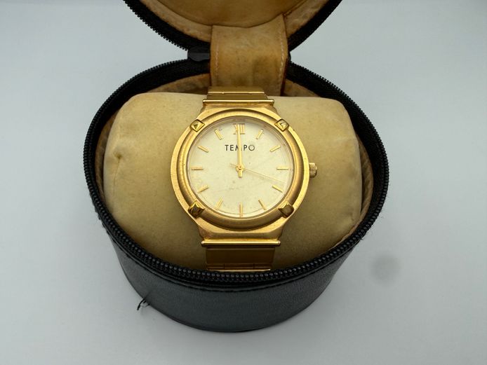 Gold Tempo watch in vintage black case