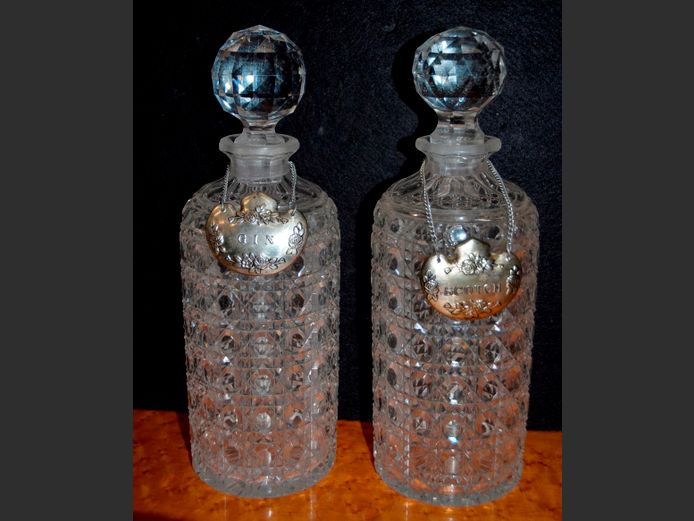 PAIR CRYSTAL DECANTERS WITH STOPPERS & SILVER PLATE DECANTER TAGS, 26cm High