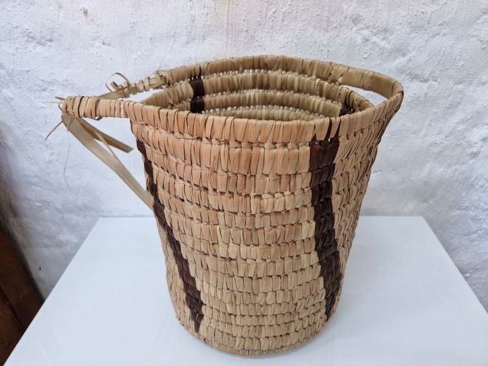 Large Hand-Woven Reed Basket with Decorative Earth-Tone Stripes