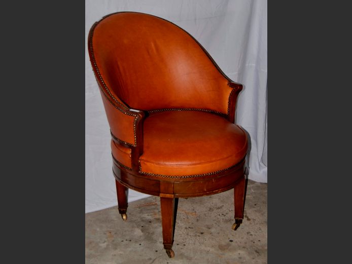 VINTAGE TAN LEATHER CHAIR WITH STUD DETAIL ON CASTORS