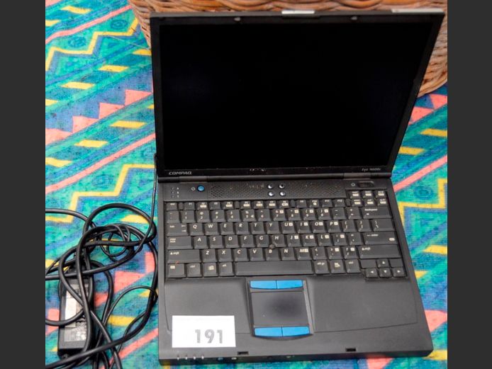 COMPAQ EVO LAPTOP WITH CHARGER [Switches on, untested further]