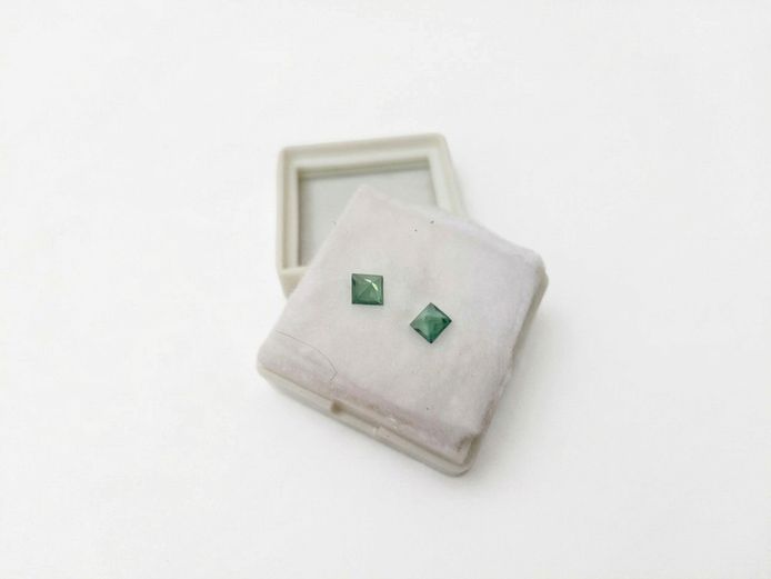 Pair of Square-Cut Faceted Green Stones (Labeled "Green Topaz", Total Weight 1.48 ct)