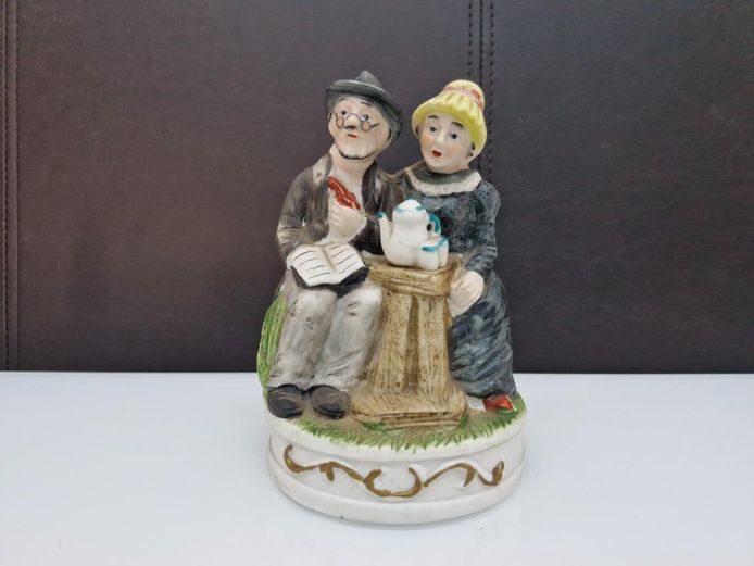 Ceramic Figurine - Old Man & Woman on Log