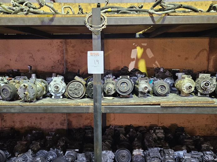 METAL SHELVING WITH VARIOUS COMPRESSORS AND COMPRESSOR PARTS