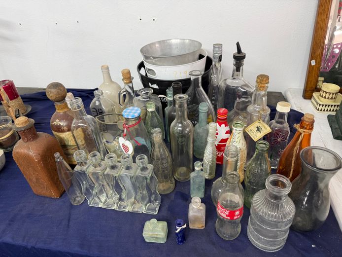 Lot of vintage glass bottles and candle holders