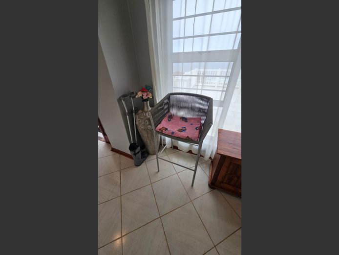 Chair, Ceramic Vase, Moonboot & Crutches