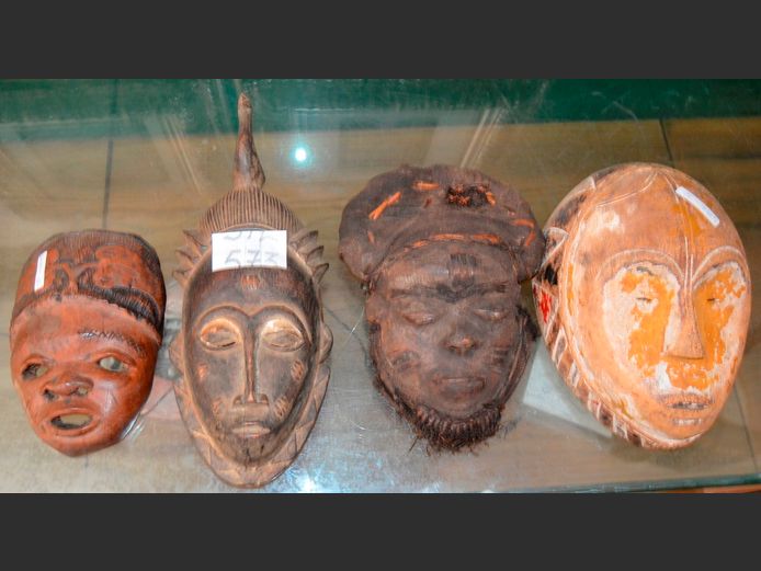 COLLECTION OF 4 CARVED AFRICAN MASKS