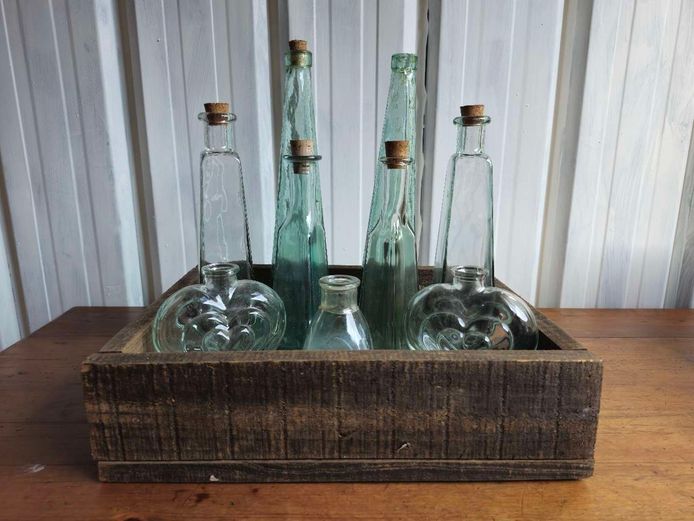 Collection of Vintage Glass Bottles in Wooden Crate