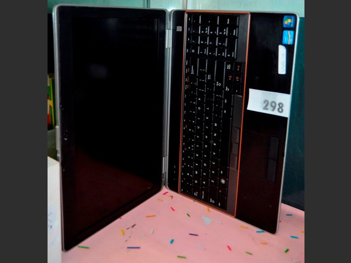 DELL LAPTOP WITH CHARGER [Switches on, untested further]