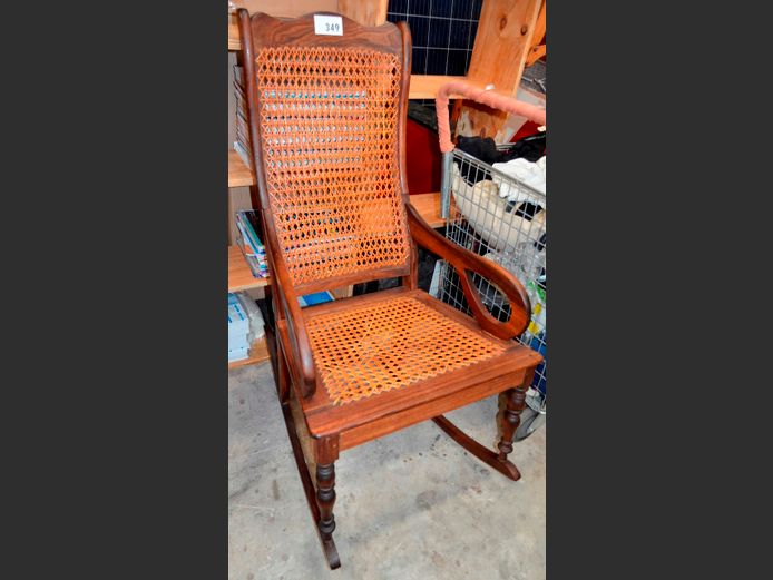 ANTIQUE STINKWOOD ROCKING CHAIR WITH RATTAN SEAT [Damage to base]
