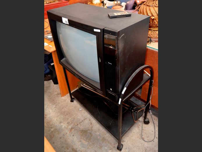 QUINTRIX 72cm COLOUR TV WITH REMOTE ON 2-TIER TROLLEY, 79 x 41 x 80cm [Switches on] ### LICENCE PLEASE ###