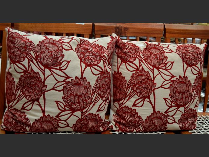 PAIR RED & WHITE "PROTEA" SCATTER CUSHIONS, 55 x 55cm