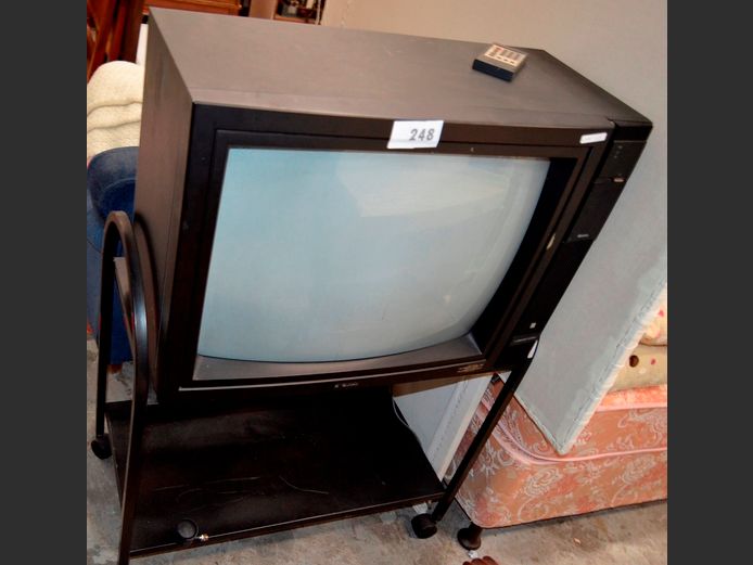 QUINTRIX 72cm COLOUR TV WITH REMOTE ON 2-TIER TROLLEY, 79 x 41 x 80cm [Switches on] ### LICENCE PLEASE ###