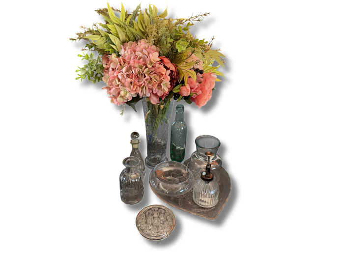 Lot of assorted glassware with faux flowers