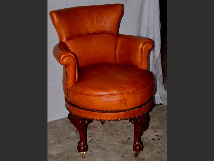 TAN LEATHER SWIVEL ARMCHAIR ON BALL & CLAW FEET WITH CASTORS