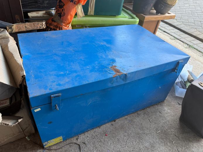 Blue metal trunk with camping accessories