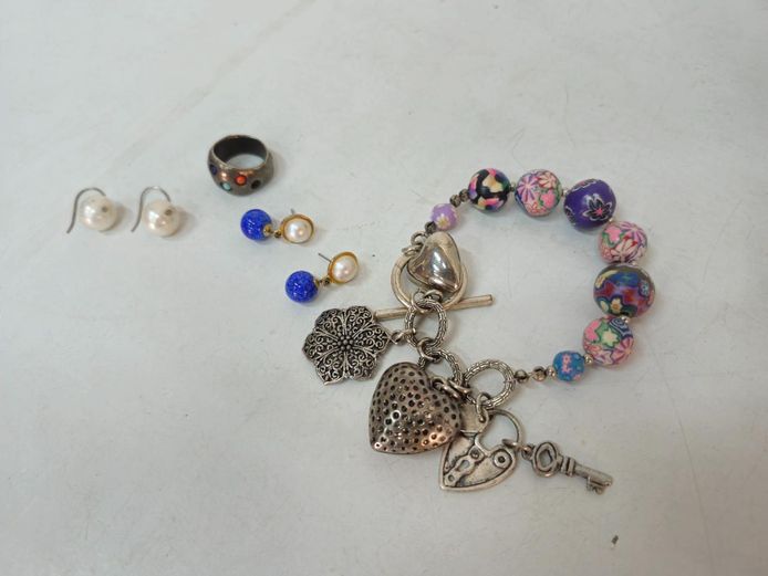 Assorted Fashion Jewelry Lot: Charm Bracelet, Earrings, and Ring