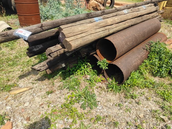 LOT GUM POLES AND STEEL PIPES
