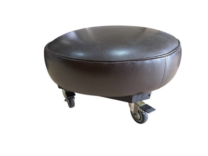 Faux leather ottoman / footstool on wheels