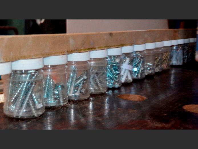 LOT: NUTS, BOLTS, SCREWS, etc IN PLASTIC JARS MOUNTED ON PLANK, 210cm Long