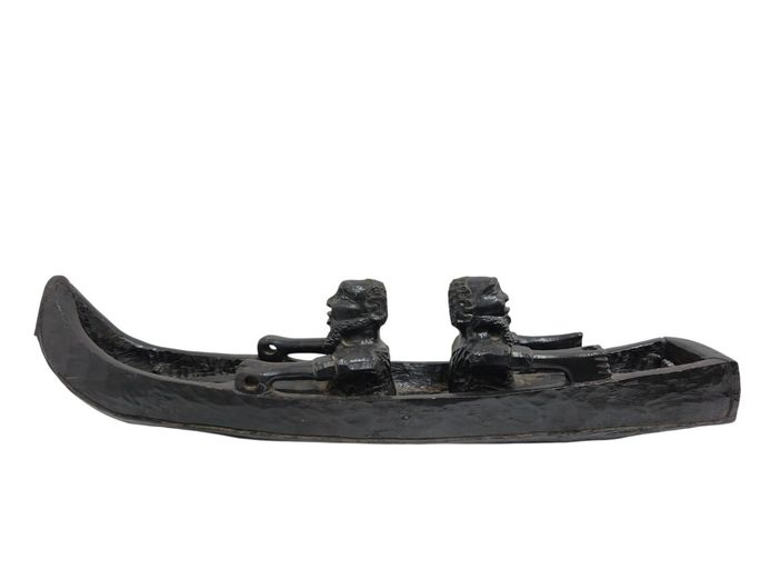Hand-Carved Dual-Figure Wooden Canoe Sculpture