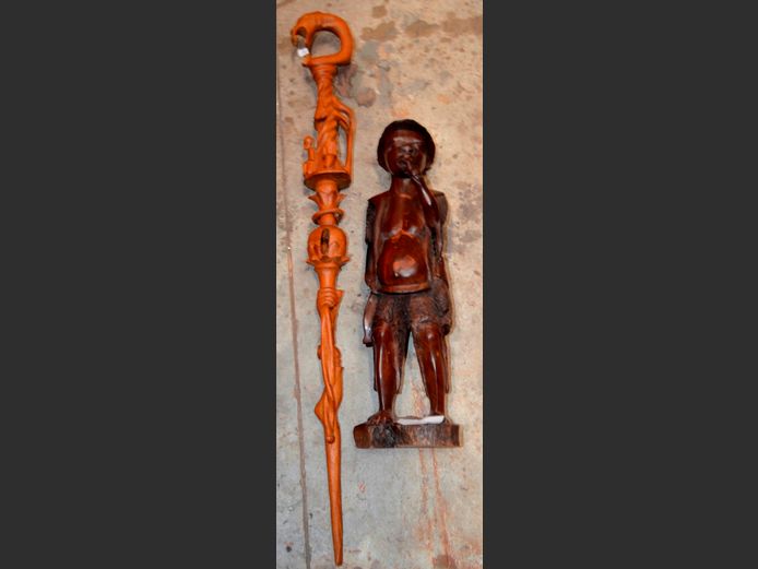 CARVED FIGURINE OF AN AFRICAN MAN, 56cm High, & A CARVED WALKING STICK, 101cm Long