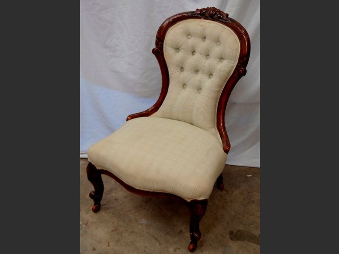 CARVED MAHOGANY GRANDMOTHER CHAIR ON CASTORS