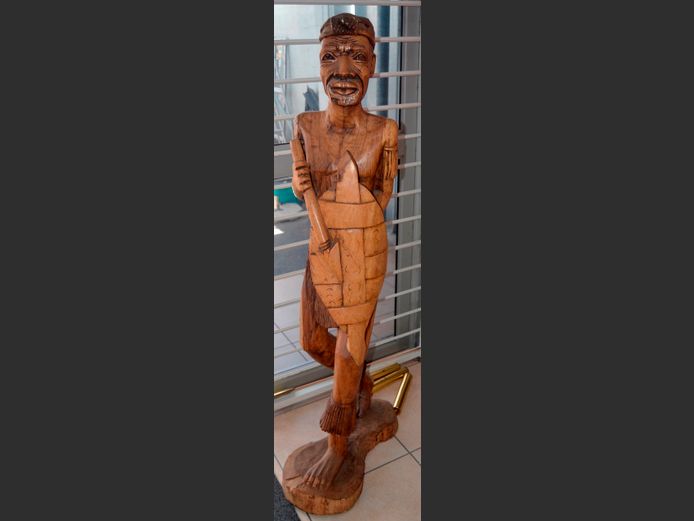 LARGE CARVED FIGURINE OF AN AFRICAN MAN, 145cm High