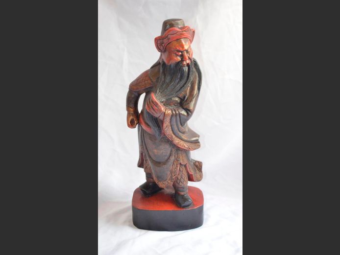 EASTERN CARVED ROSEWOOD FIGURINE OF A MAN, 46cm High