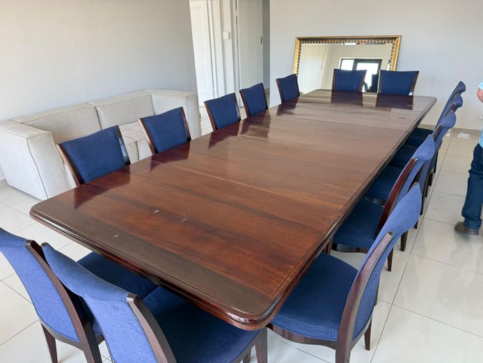 16 Seater Grand Mahogany Table in excellent condition with original wheels and winder