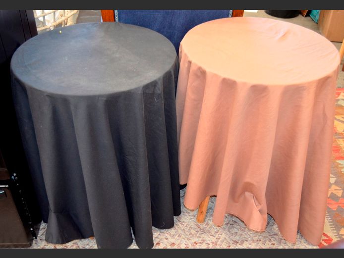LOT OF 2: DRAPE TABLES WITH TABLECLOTHS, 50cm Diameter x 66cm High & 51cm Diameter x 65cm High