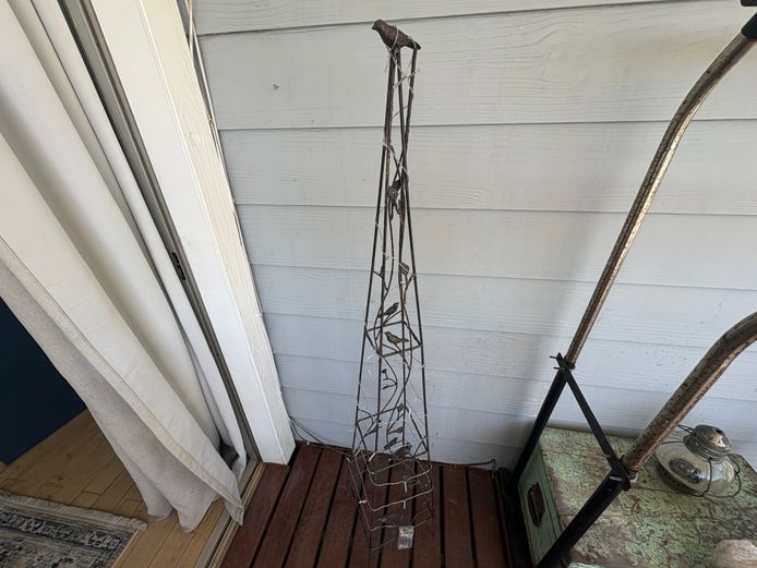 Set of two metal decorative trellises with battery operated fairy lights on each