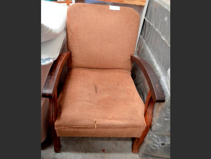 BROWN UPHOLSTERED ARMCHAIR [Seat torn & sunken]