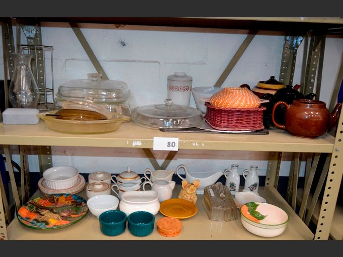 LOT ON 2 SHELVES: TEAPOTS, GRAVY BOAT, SUGAR BOWLS, etc