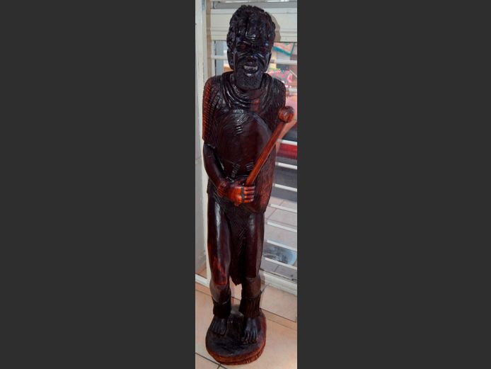 LARGE CARVED FIGURINE OF AN AFRICAN MAN, 147cm High