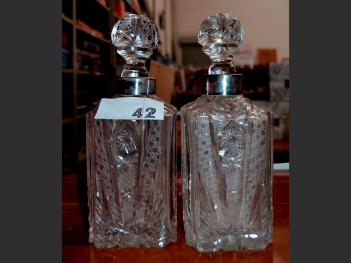 PAIR CUT GLASS DECANTERS WITH STOPPERS & SILVER PLATE CUFFS, 25cm High