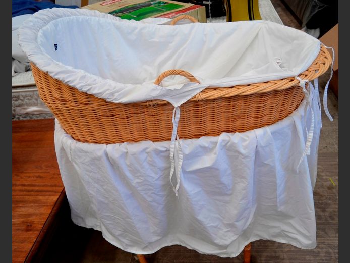 WICKER CRIB ON STAND