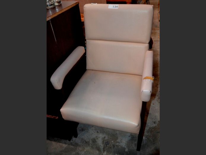 BEIGE VINYL UPHOLSTERED ARMCHAIR ON METAL BASE [1 arm needs re-covering]